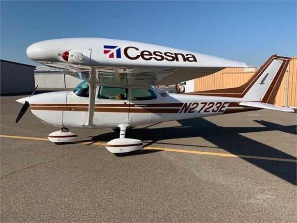 Left-side exterior profile of Cessna 172N N2723E parked on the ramp in clear weather.